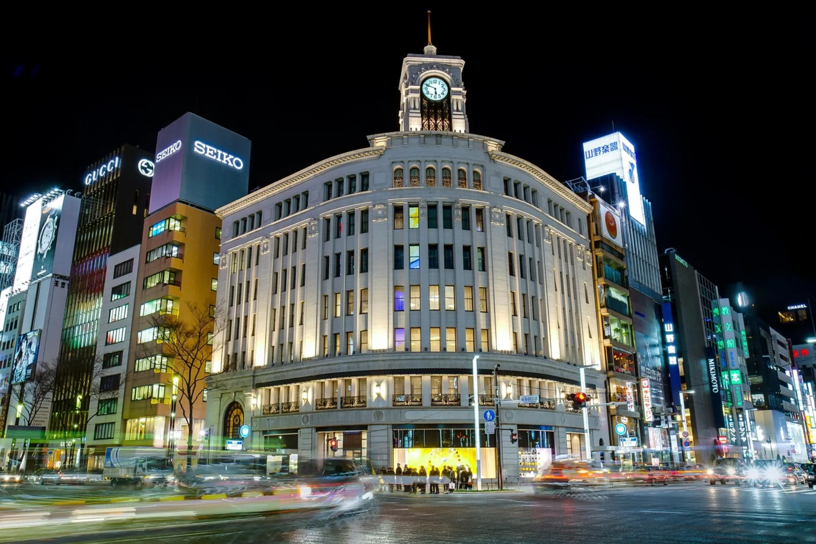 The illuminated Wako clock tower on the main crossing of Ginza at night