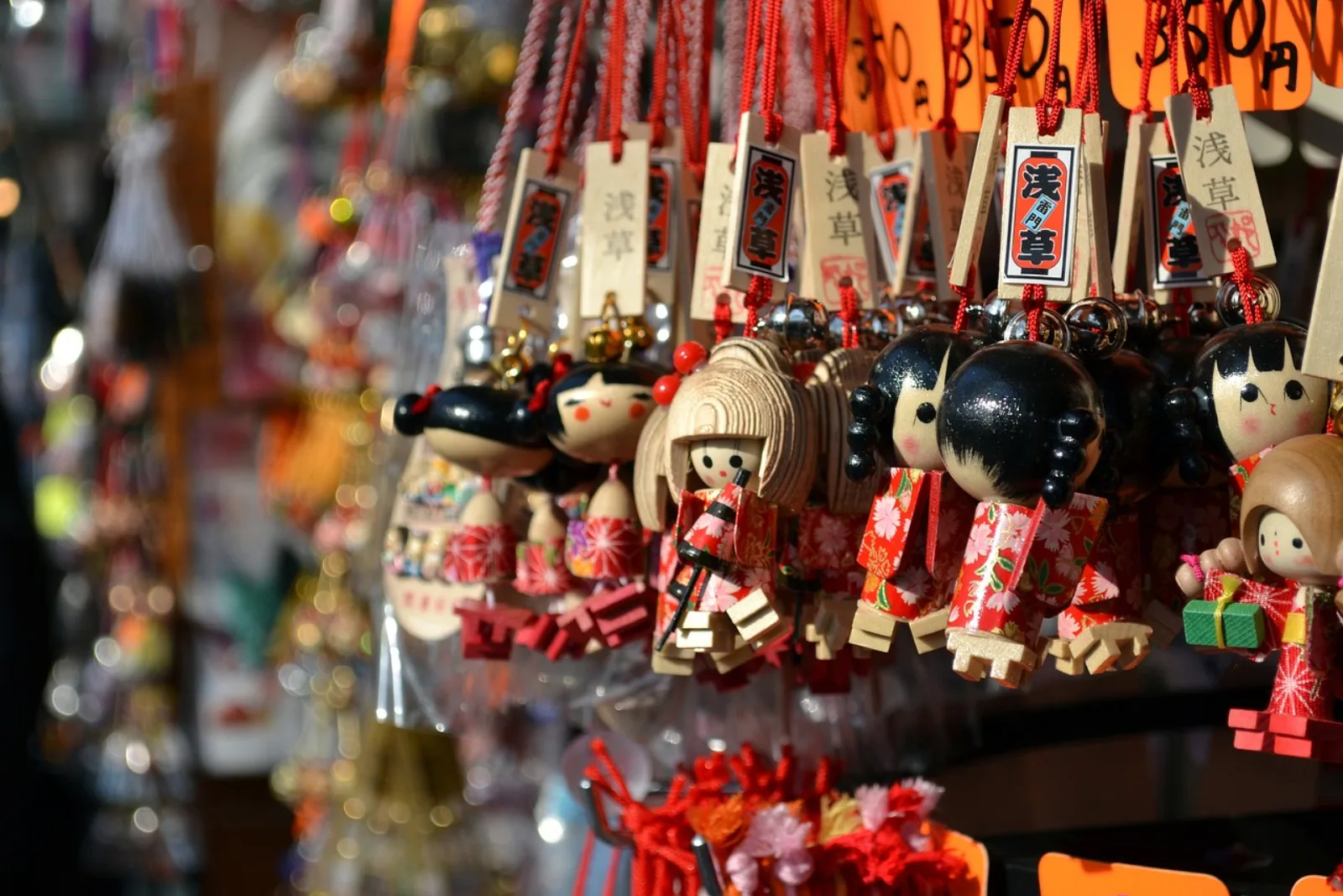 Colourful Japanese souvenirs and charms hanging in a Tokyo shop
