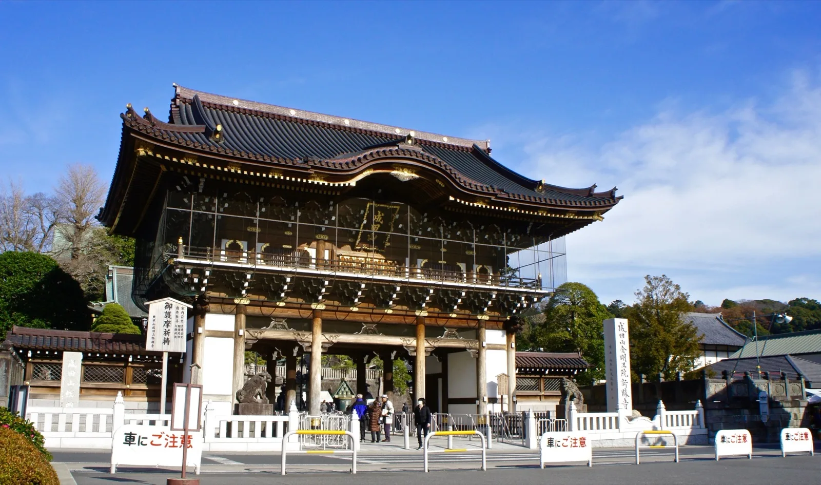 The great wooden main gate of Naritasan Shinshoji temple in Narita under a blue sky