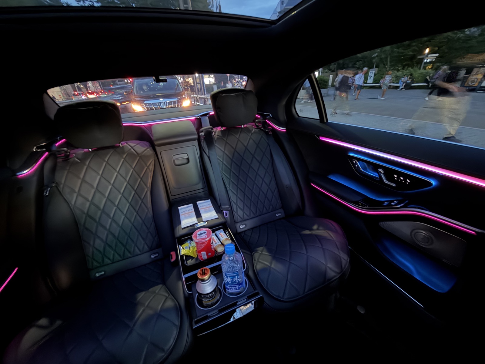Ambient-lit rear cabin of a Driven Tokyo Mercedes chauffeur car at dusk